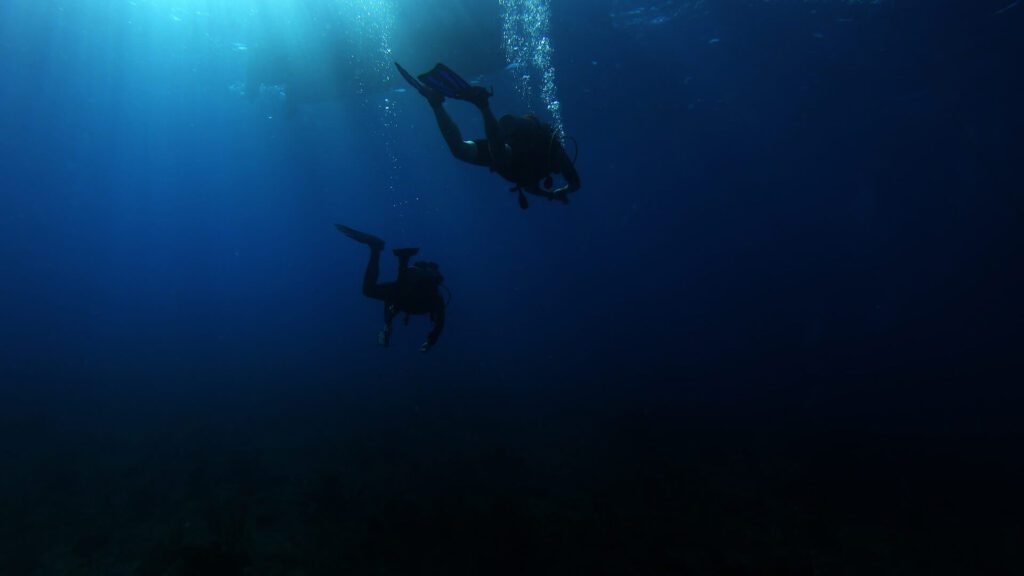 Two divers underwater at Cayman Islands