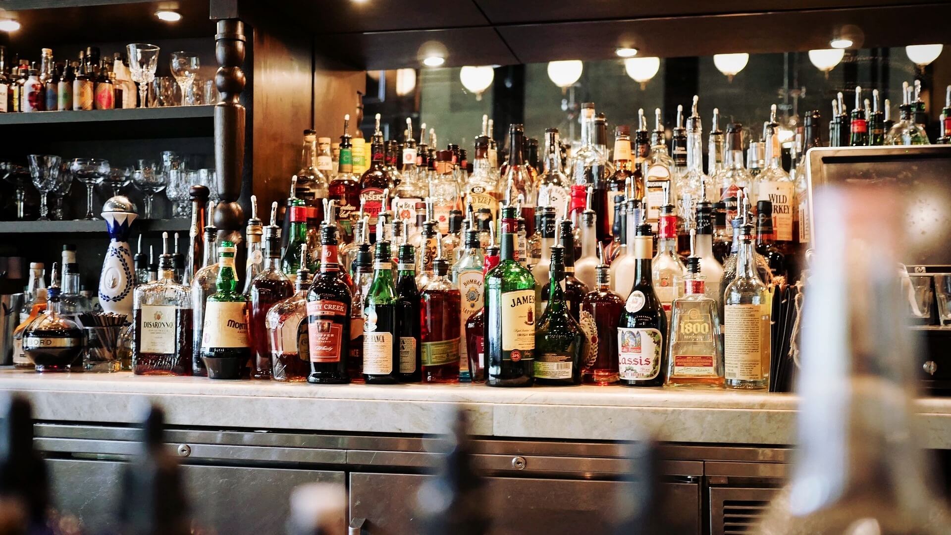 A bar with a lot of liquor bottles on it